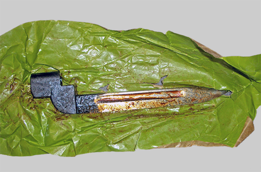 Image of British No. 9 Mk. I bayonet in wrapper with mineral oil preservative